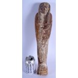 A LARGE AND EARLY EGYPTIAN PAINTED POLYCHROMED WOOD USHABTI possibly Middle Kingdom, modelled encase