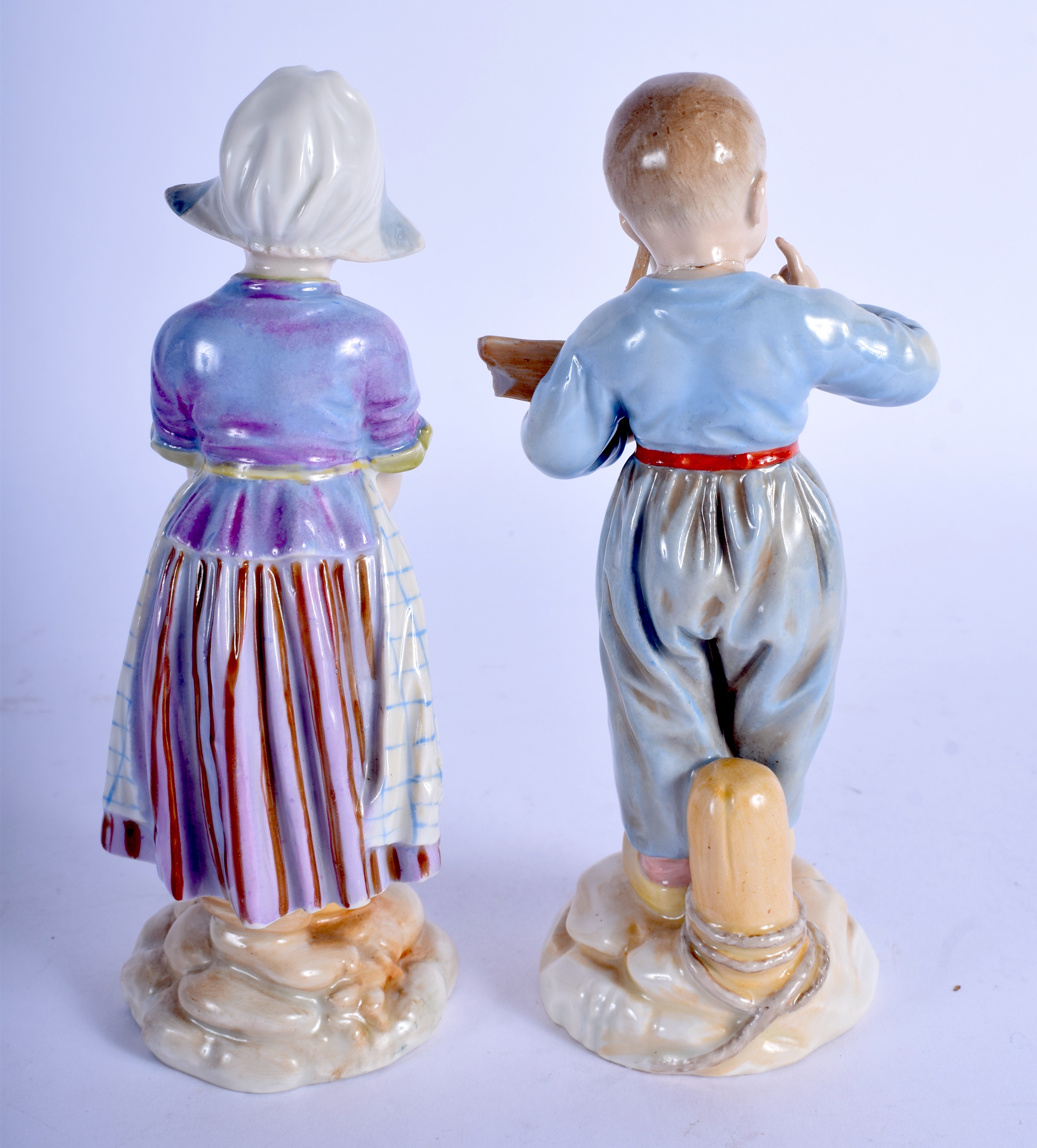 A PAIR OF 19TH CENTURY GERMAN PORCELAIN FIGURES possibly Hoscht, one holding a toy boat. 15 cm high. - Image 2 of 3