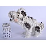 AN EARLY 20TH CENTURY GERMAN DRESDEN PORCELAIN FIGURE OF A DOG modelled as a bolognese dog. 26 cm x