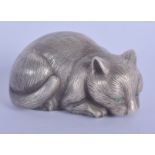 A CONTINENTAL SILVER AND EMERALD EYED FIGURE OF A CAT. 2.2 oz. 7 cm x 3 cm.