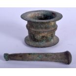 A 14TH/15TH CENTURY ISLAMIC BRONZE PESTLE AND MORTAR. 8 cm wide. (2)