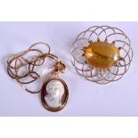 A GOLD MOUNTED NECKLACE together with a gold mounted amber brooch. 8 grams. (2)