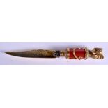 A CONTINENTAL SILVER GILT ENAMEL AND DIAMOND ELEPHANT PAPER KNIFE with jewelled decoration. 4.1 oz.