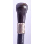 A 19TH CENTURY CONTINENTAL CARVED RHINOCEROS HORN HANDLED WALKING CANE. 90 cm long.