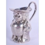 A VERY RARE EDWARDIAN NOVELY WHITE METAL CREAM JUG Attributed to Hayes & Co, in the form of a toby j