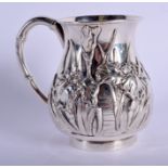 A LOVELY 19TH CENTURY JAPANESE MEIJI PERIOD SILVER MUG decorated with foliage. 138 grams. 8.5 cm hig