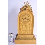 A LARGE 19TH CENTURY FRENCH ORMOLU EMPIRE MANTEL CLOCK decorated with a muscular male holding game w