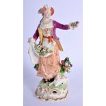 Derby figure of a shepherdess with a sheep at her feet. 21.5 cm high.