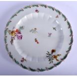 Chelsea feather edged plate painted with flowers, brick red anchor mark. 21 cm wide.