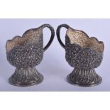 A PAIR OF 19TH CENTURY MIDDLE EASTERN SILVER CUP HOLDERS. 13.3 oz. 13 cm high.