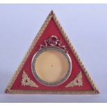 AN UNUSUAL CONTINENTAL 14CT GOLD GEM STONE ENAMEL AND IVORY PHOTOGRAPH FRAME of triangular form. 107