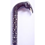 A 19TH CENTURY ANGLO INDIAN CARVED BONE AND EBONY WALKING CANE. 85 cm long.