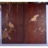 A PAIR OF 19TH CENTURY JAPANESE MEIJI PERIOD IVORY AND BOXWOOD PANELS depicting birds amongst foliag