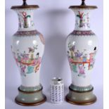 A PAIR OF EARLY 20TH CENTURY CHINESE FAMILLE ROSE PORCELAIN VASES Guangxu, converted to lamps. Porce