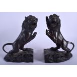 A PAIR OF 19TH CENTURY JAPANESE MEIJI PERIOD BRONZE BOOKENDS in the form of rearing lions. 22 cm x 1