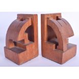 A CHARMING PAIR OF STYLISH 1950S ANGULAR LIMED OAK BOOKENDS of almost figural form. 18 cm x 9.5 cm.