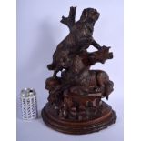 A LARGE 19TH CENTURY BAVARIAN BLACK FOREST CARVED WOOD FIGURAL GROUP modelled as two hounds upon a r