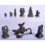 A GROUP OF 18TH CENTURY INDIAN BRONZE SEALS AND WEIGHTS in various forms and sizes. Largest 12 cm wi