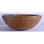 A LARGE 19TH CENTURY CONTINENTAL FRUITWOOD DAIRY BOWL with period iron repair. 45 cm diameter.