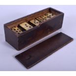 A CASED SET OF VINTAGE DOMINOS. (qty)