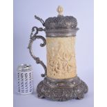 A LARGE 18TH/19TH CENTURY CONTINENTAL SILVER MOUNTED IVORY TANKARD decorated with figures and animal