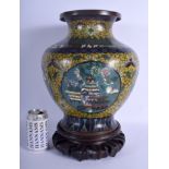 A LARGE EARLY 20TH CENTURY CHINESE CLOISONNE ENAMEL VASE Late Qing/Republic, decorated with foliage.