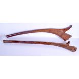 A NEAR PAIR OF 19TH CENTURY TONGAN FIJIAN FIGHTING TRIBAL CLUBS with gun stock terminals. 100 cm lon