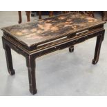 A 19TH CENTURY CHINESE BLACK LACQUERED LOW TABLE decorated with figures. 46 cm x 85 cm.