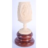 A 19TH CENTURY ANGLO INDIAN CARVED IVORY GOBLET together with a gilt metal box. Largest 16 cm high.