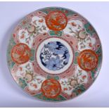 A LARGE 19TH CENTURY JAPANESE MEIJI PERIOD IMARI CHARGER painted with figures and foliage. 39 cm dia