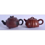 TWO CHINESE YIXING POTTERY TEAPOTS AND COVERS 20th Century. 18 cm wide. (2)