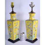 A PAIR OF EARLY 20TH CENTURY JAPANESE MEIJI PERIOD YELLOW GLAZED VASES painted with birds and flower