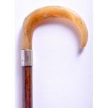 A 19TH CENTURY CONTINENTAL CARVED BUFFALO HORN HANDLED WALKING CANE. 88 cm long.