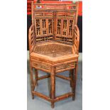AN EARLY 20TH CENTURY CHINESE TYPE CARVED BAMBOO CHAIR Brighton Pavilion 90 cm x 43 cm.
