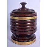 A 19TH CENTURY TREEN CARVED WOOD RIBBED BOX AND COVER possibly a tea caddy. 17 cm x 7.5 cm.