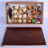 A BOX OF ANTIQUE CARVED AND STAINED IVORY SNOOKER BALLS. Approx 2.2 kgs. Largest 4 cm diameter. (qty
