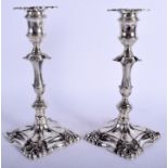 A PAIR OF GEORGE III PAKTONG CANDLESTICKS upon acanthus capped bases. 24 cm high.