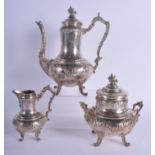 A 19TH CENTURY CONTINENTAL THREE PIECE SILVER TEASET of scrolling rococo form. 79 oz. Largest 28 cm