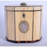 A GEORGE III CARVED BONE AND TORTOISESHELL TEA CADDY with silver mounts. 10 cm x 10 cm.