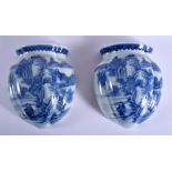 A VERY RARE PAIR OF 19TH CENTURY CHINESE BLUE AND WHITE WALL POCKETS bearing Qianlong marks to base,