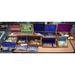 A HUGE QUANTITY OF BOXED ANTIQUE SILVER PLATED IVORY CUTLERY in various forms and sizes, contained w