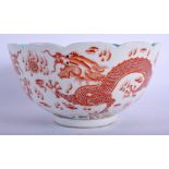 A CHINESE PORCELAIN LOTUS FORM BOWL 20th Century, bearing Qianlong marks to base, painted with drago