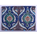 A TURKISH MIDDLE EASTERN FAIENCE GLAZED POTTERY TILE painted with floral sprays. 24 cm x 32 cm.