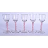 A SET OF FIVE 18TH CENTURY ENGLISH GLASSES C1770 with pink and white spiral twist stems. 16 cm high.