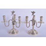 A PAIR OF ANTIQUE FRENCH TRIPLE BRANCH SILVER CANDLEABRA with cherub terminals. 40.9 oz. 22 cm x 11