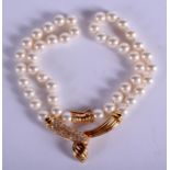 A 14CT GOLD DIAMOND AND PEARL NECKLACE. 34 cm long.