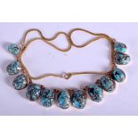 A VINTAGE GOLD MOUNTED TURQUOISE NECKLACE. 48 cm long, largest bead 1.75 cm x 0.5 cm.