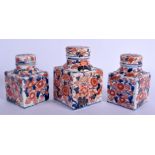 A GROUP OF THREE 18TH CENTURY CHINESE EXPORT IMARI TEA CANISTERS Qianlong. Largest 13 cm x 8 cm. (3)