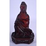 AN EARLY 20TH CHINESE RED AMBER TYPE FIGURE OF GUANYIN Late Qing/Republic. 301 grams.