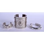 THREE OMANI MIDDLE EASTERN SILVER BANGLES. 19.6 oz. Largest 7.5 cm wide. (3)